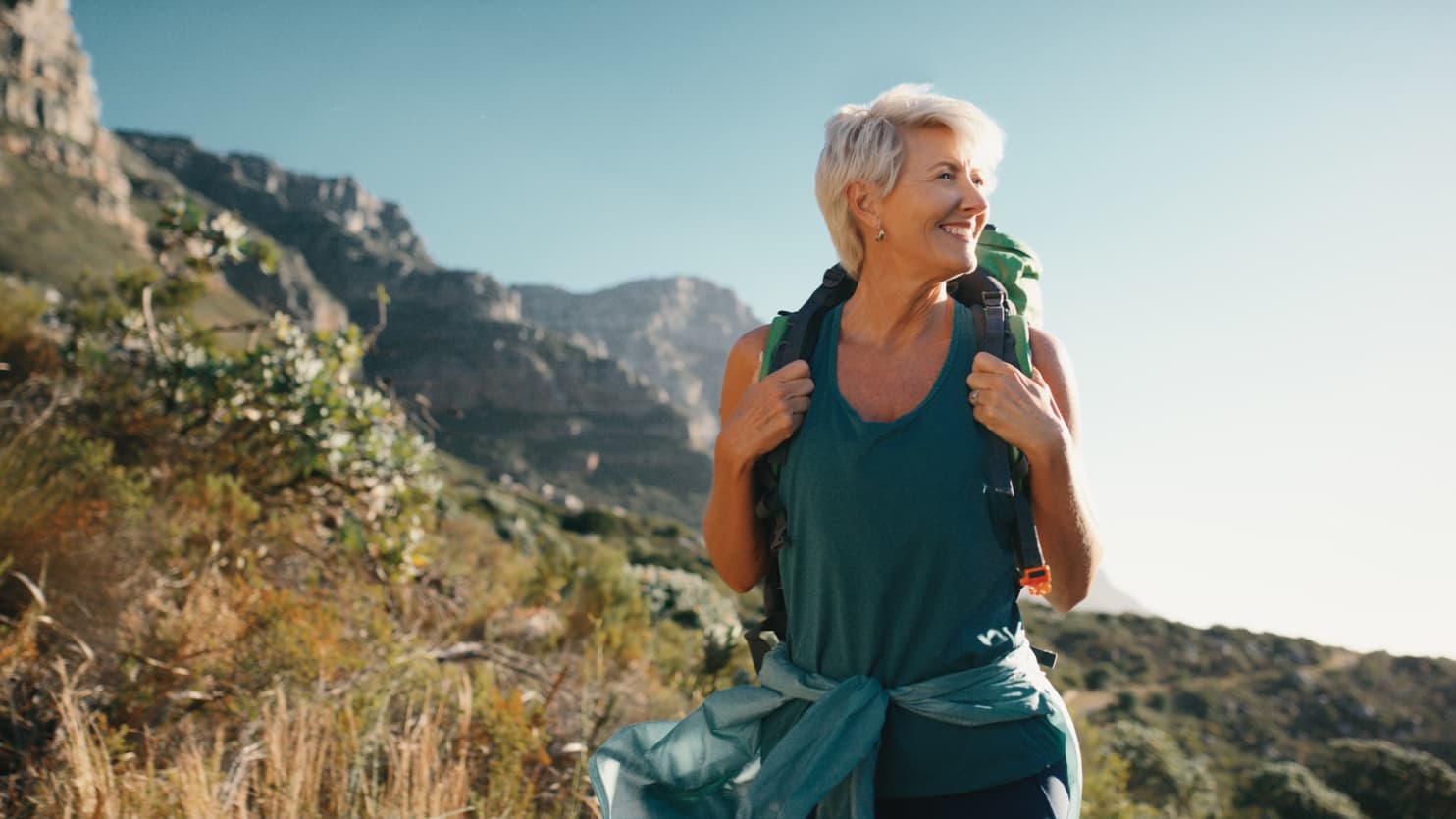 older woman hiking after knee replacement surgery exercises