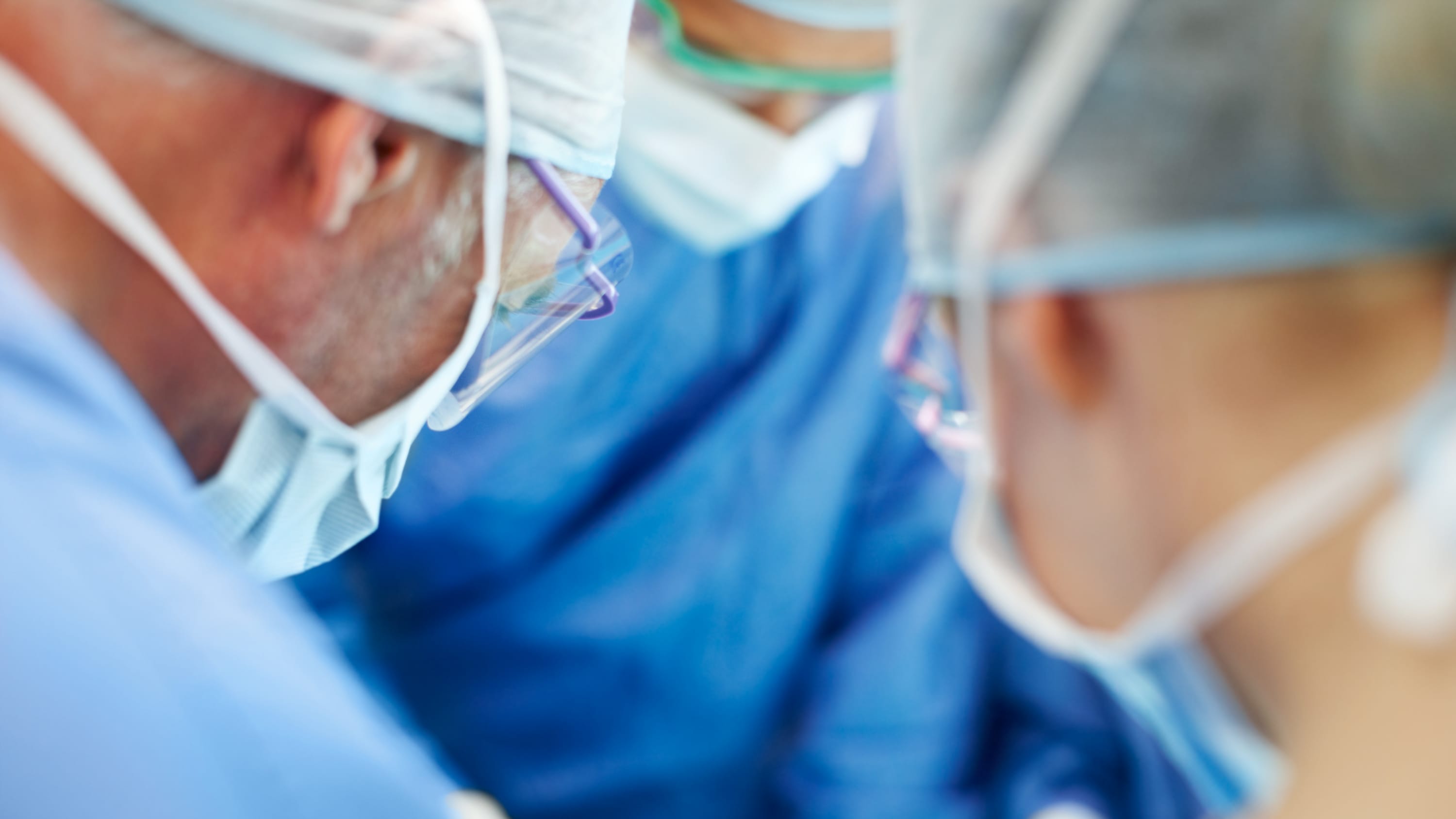 surgeons using minimally invasive techniques to treat aneurysm