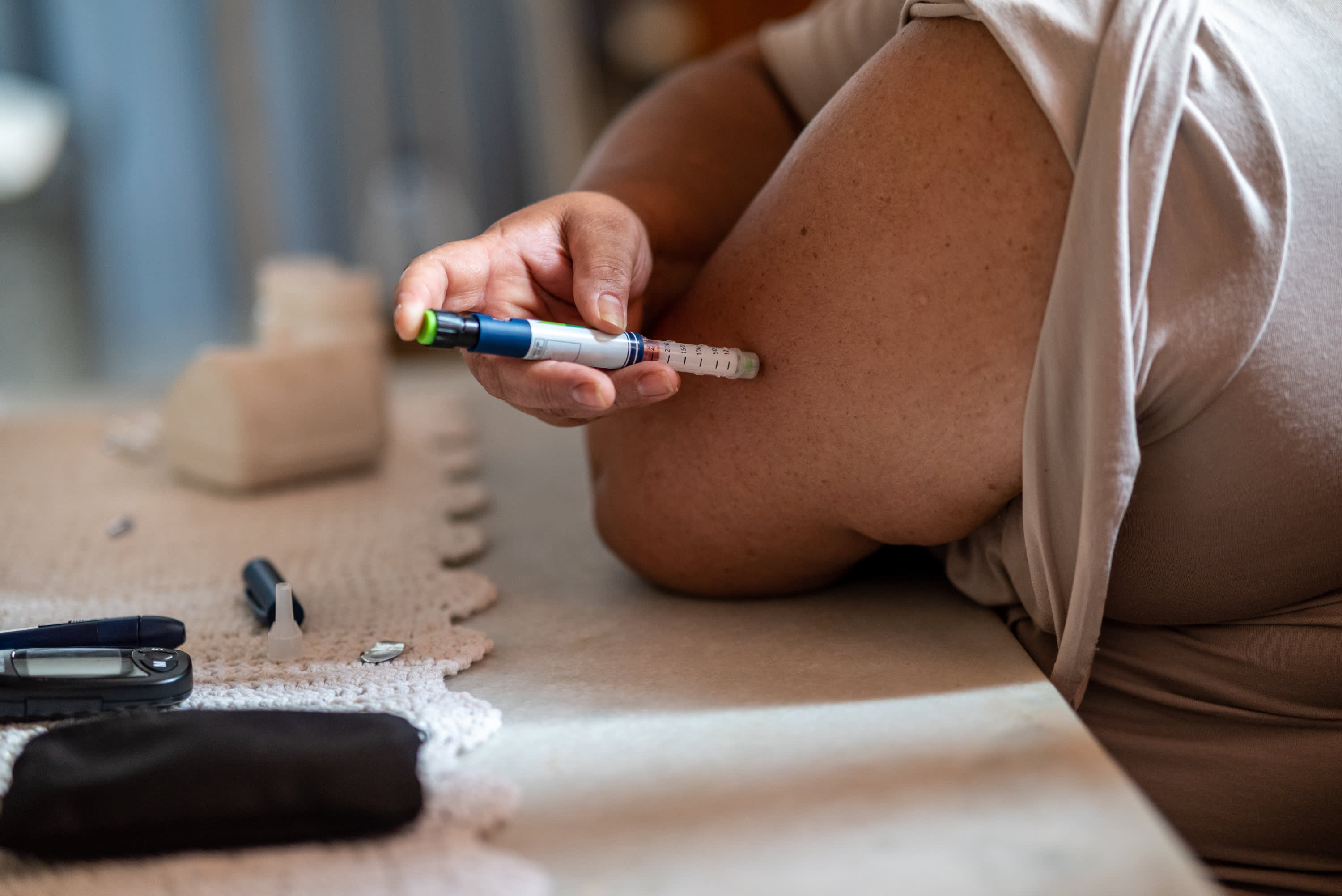 person with diabetes injecting medications