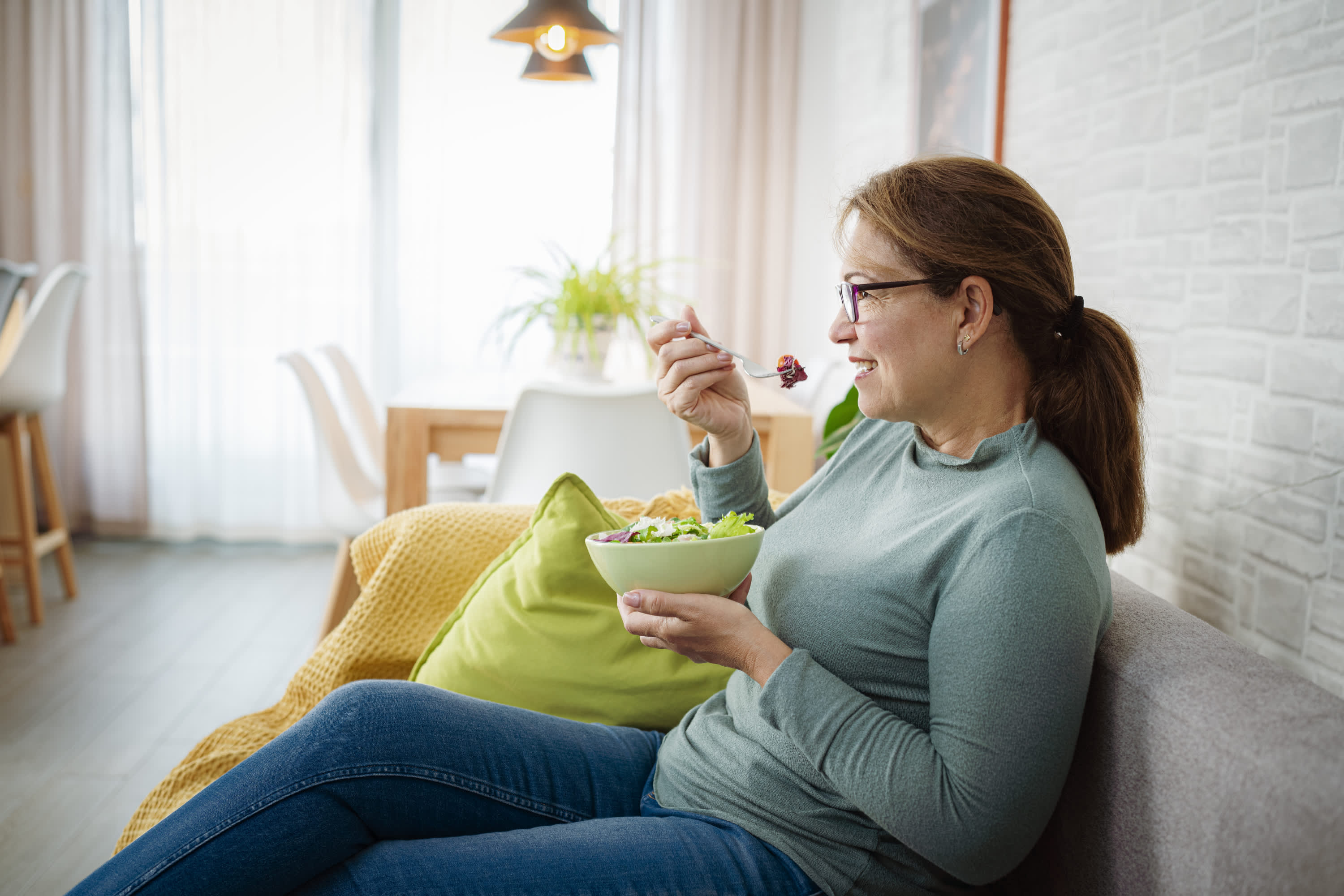 woman with diabetes eating a salad