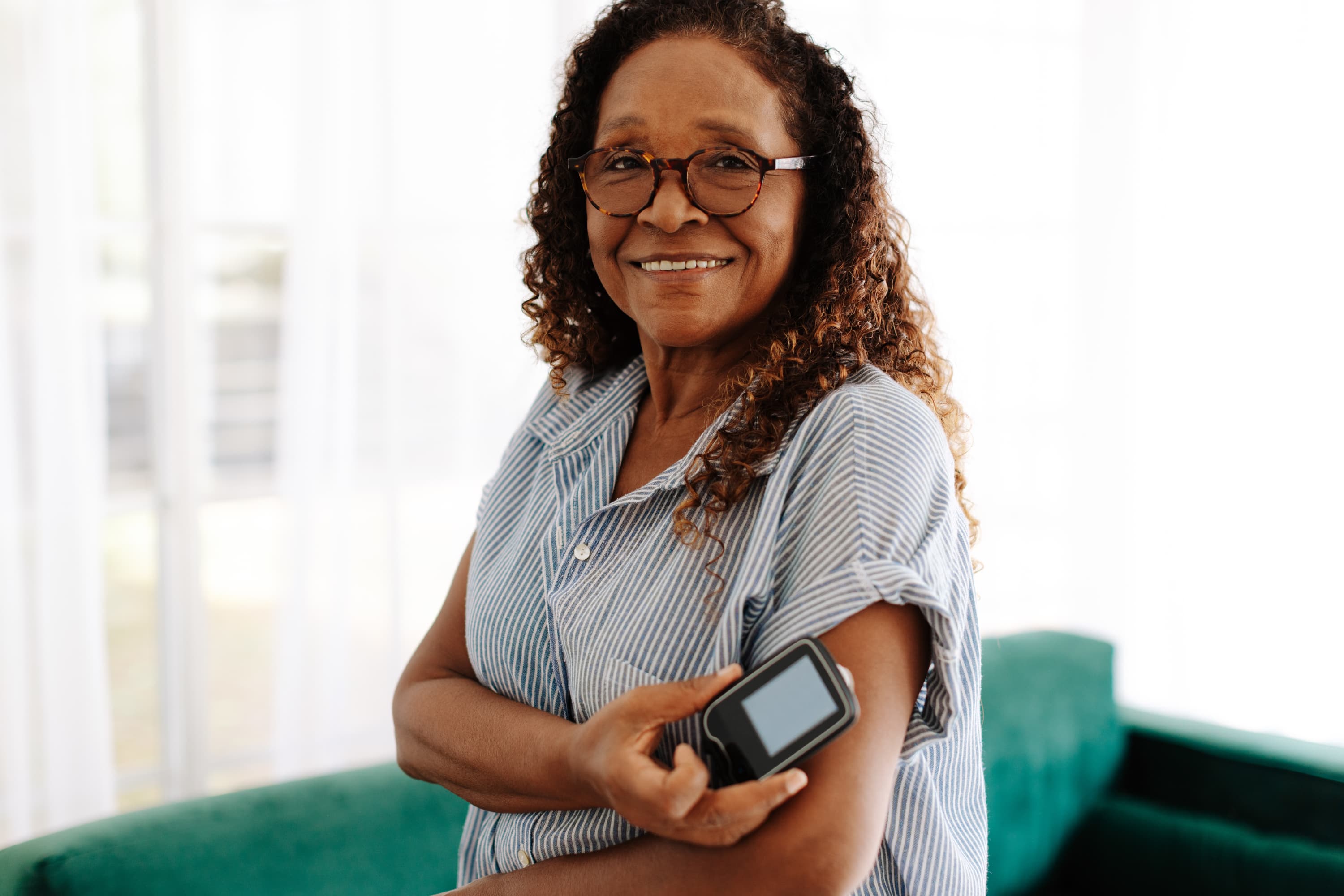 smiling Black woman managing her diabetes